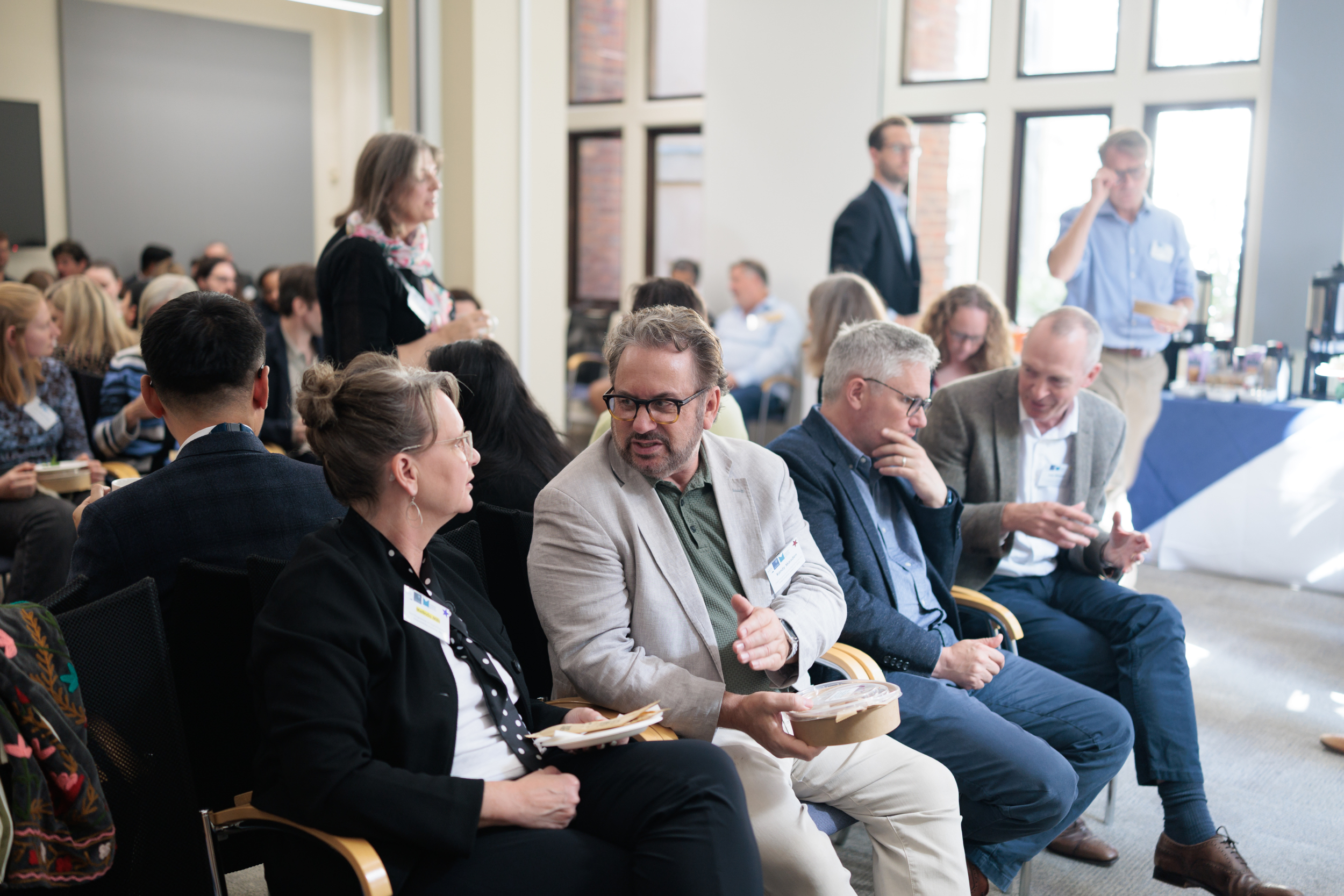 LCDS Director, Professor Melinda Mills, talking to Randy Marsden CEO of HouseQuest and delagates from the workshop.