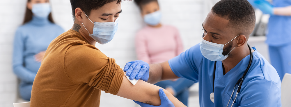 Man receiving COVID vaccine