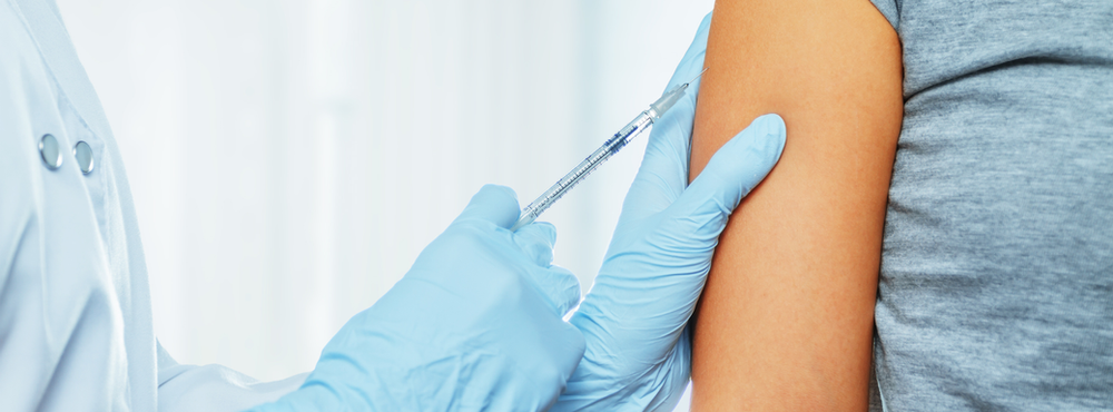 Woman receiving vaccine