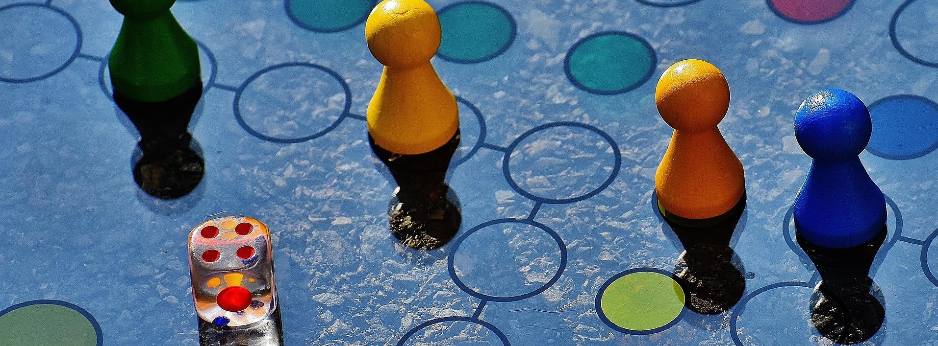 Pieces and dice on a Ludo board