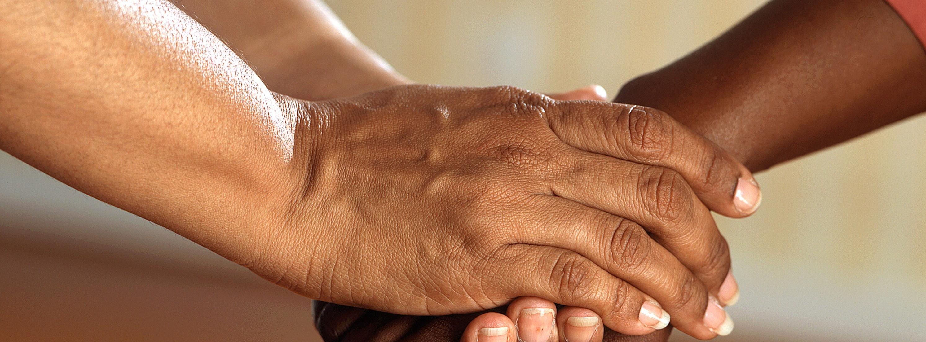 Two people holding hands