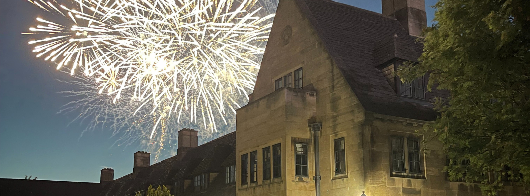 Nuffield college at night with fireworks in background