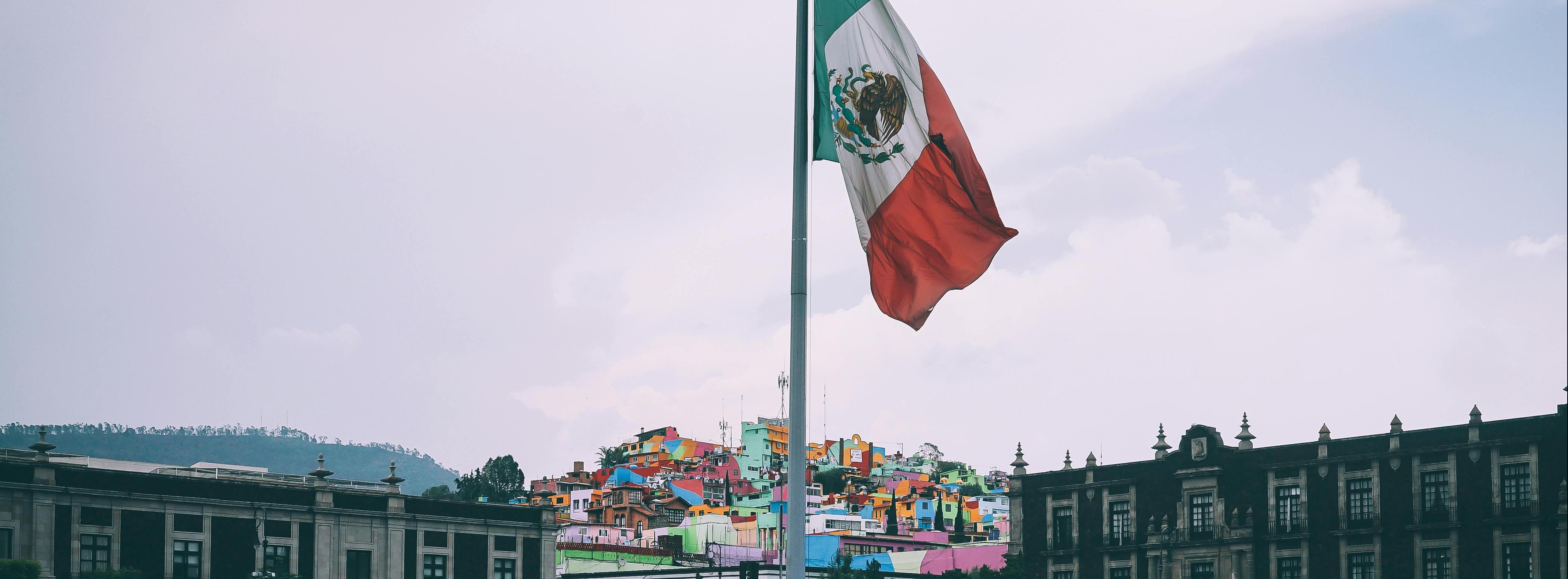 People Near Mexican Flag