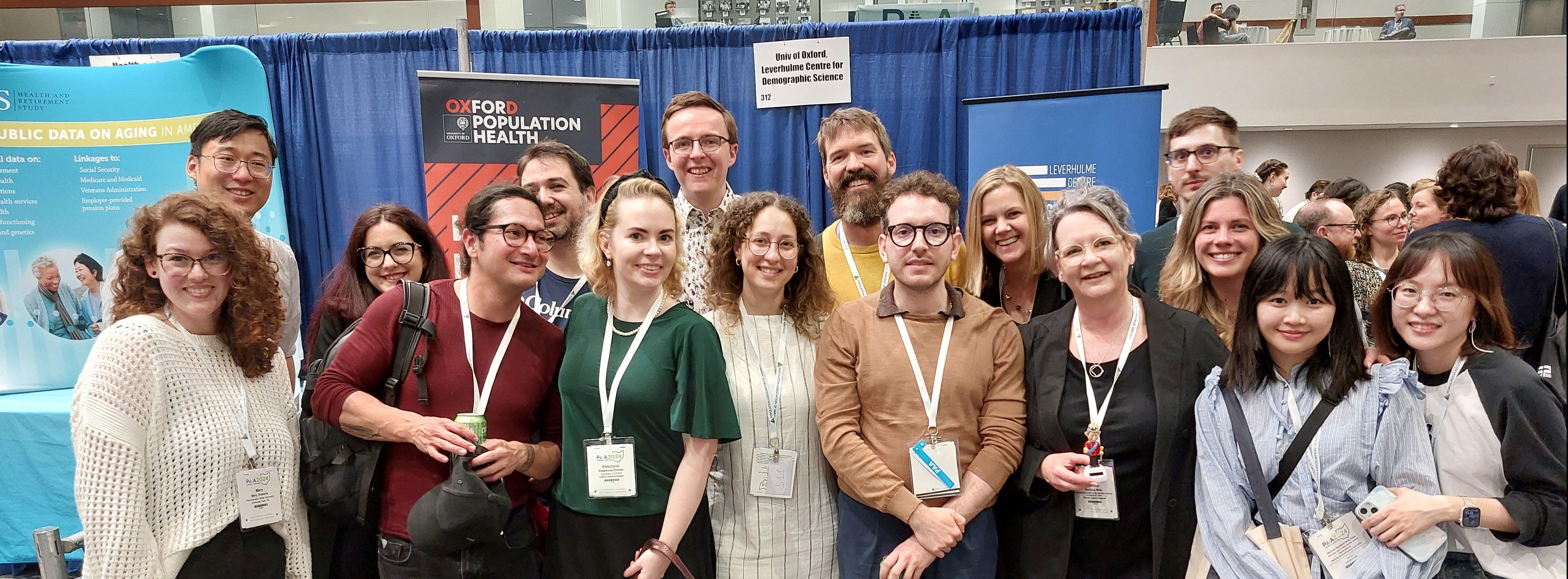 Members of LCDS in front of booth at PAA 2025