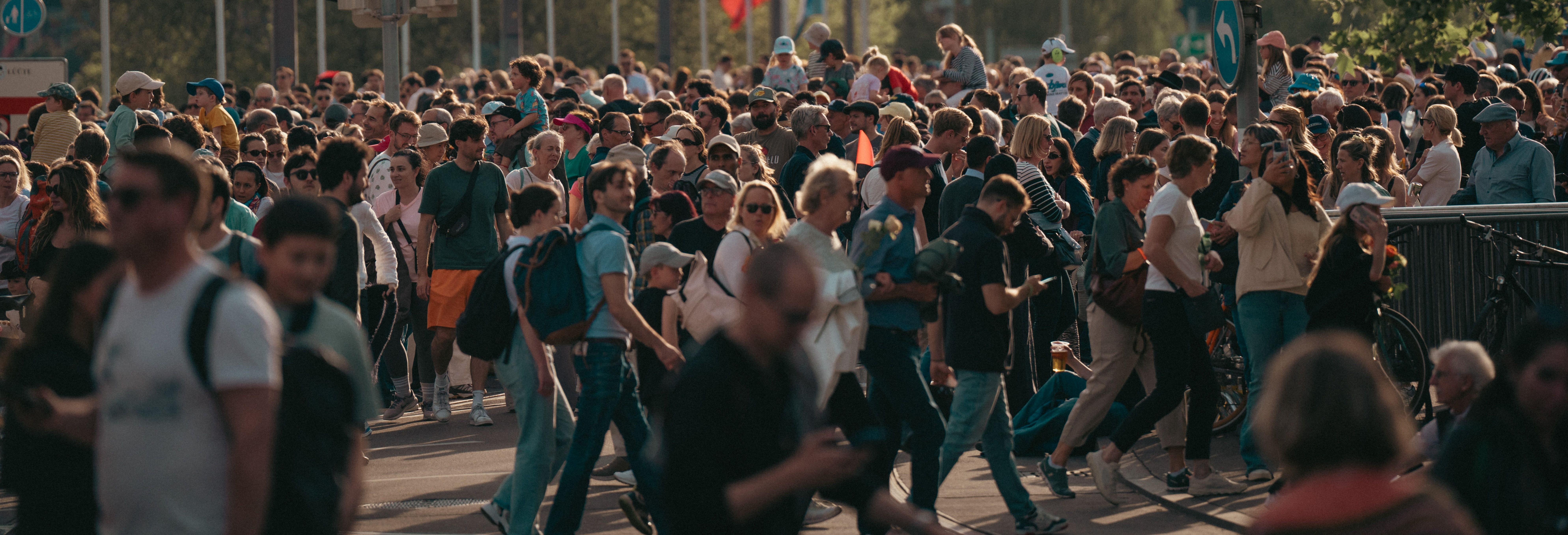 A bustling city street with a diverse crowd. Image credit: Sergio Zhukov. Pexels.