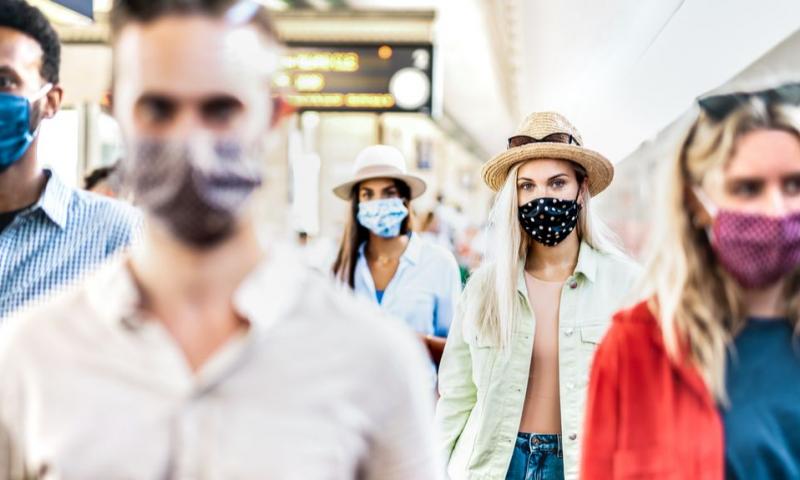 People wearing face coverings