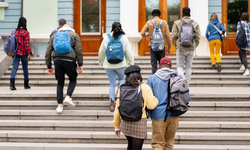 Young adults climbing up stairs