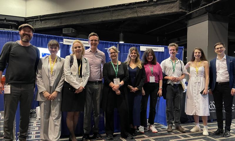 LCDS members in front of our booth at PAA 2023