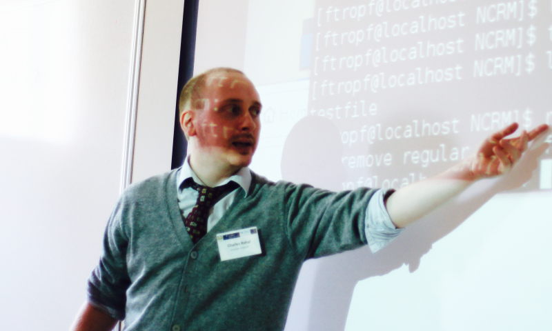 Dr Charles Rahal presenting code at a Summer School