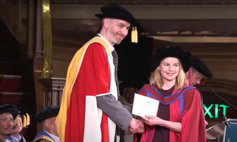 Ursula receives the award at her graduation ceremony