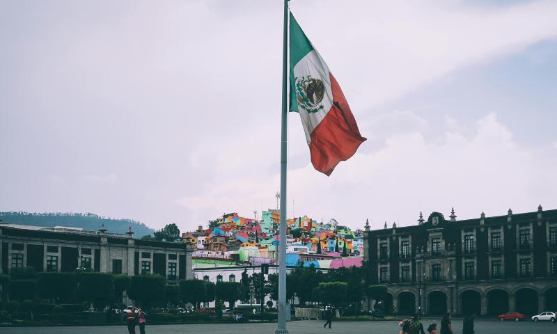 People Near Mexican Flag